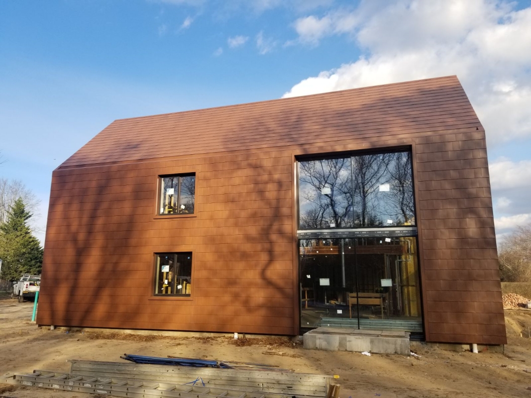 Metal panel roof to wall