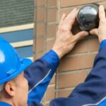 Workers install cameras at their doorstep