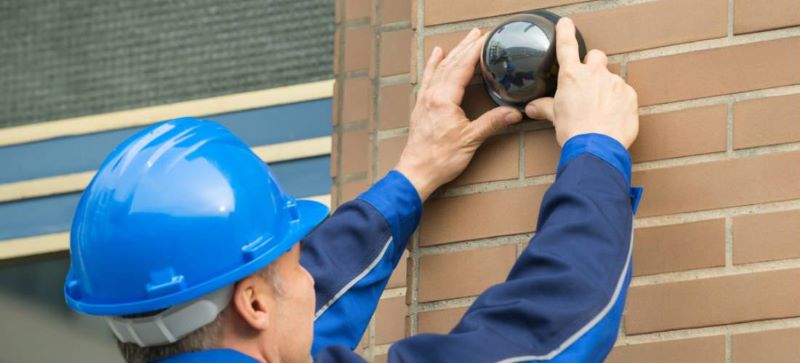 Workers install cameras at their doorstep