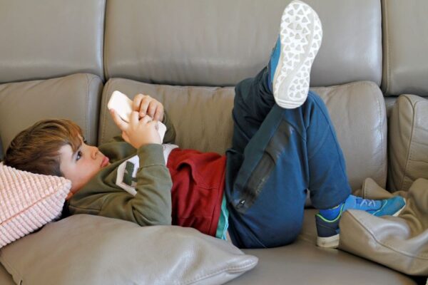 Children playing with mobile phones