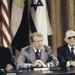President Carter, center, is flanked by Egyptian President Anwar Sadat and Israeli Prime Minister Menachem Begin as they face newsmen at the conclusion of their Middle East peace talks at Camp David in Maryland in September 1978.