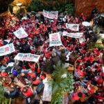 Demonstrators from the human rights organization Jewish Voice for Peace hold a civil disobedience action