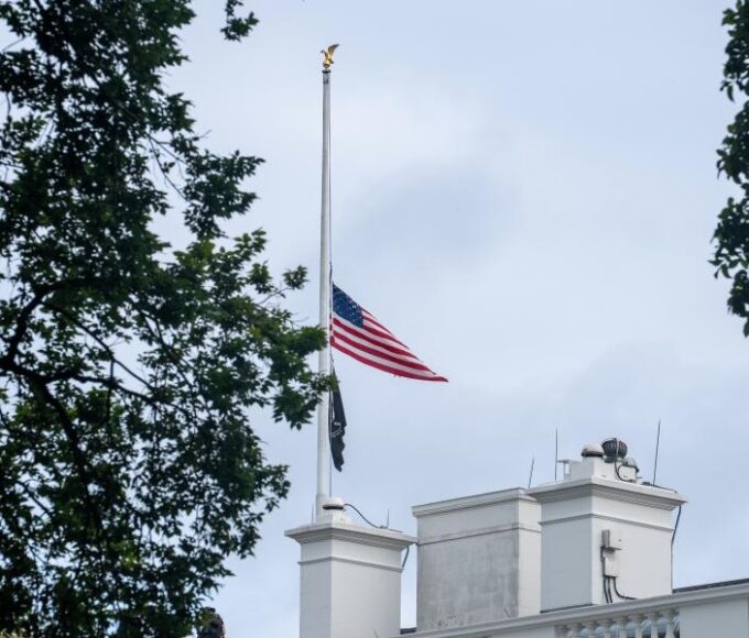 U.S. flags fly at half-mast