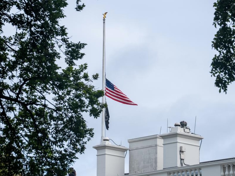 U.S. flags fly at half-mast