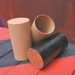 Low-carbon building materials: cardboard and soil