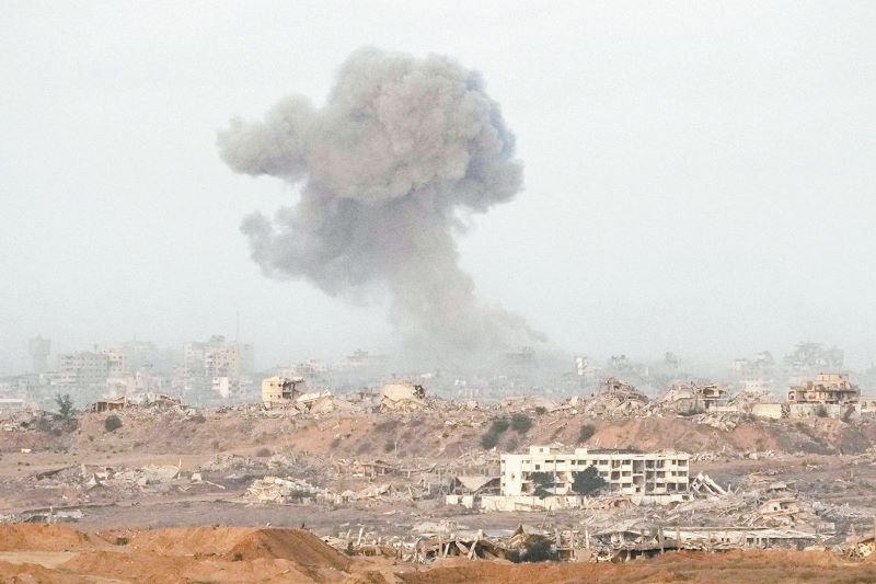Explosion cloud over destroyed city