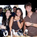 People showcasing watches at a product event