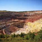 Colorful layered open-pit mine landscape