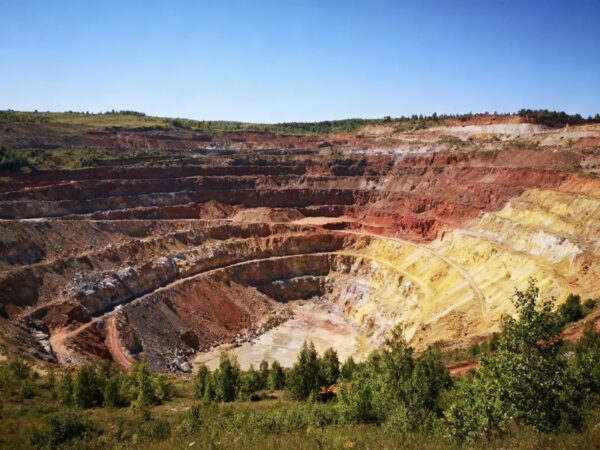 Colorful layered open-pit mine landscape