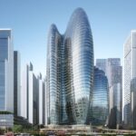 Futuristic glass skyscraper with organic shape in city skyline