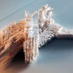 Intricate white 3d-printed architectural sculpture