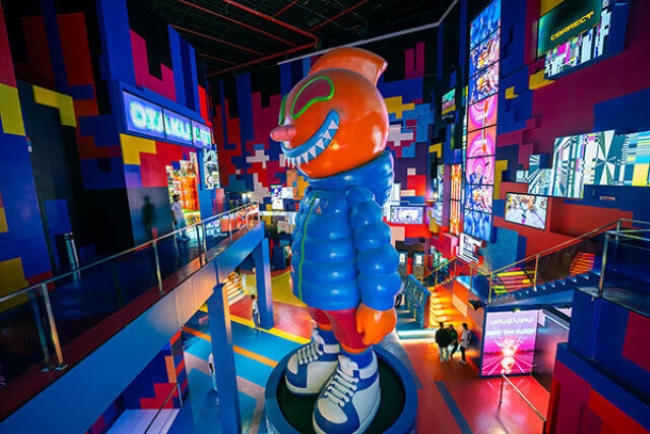 Vibrant colorful interior with large cartoon character statue