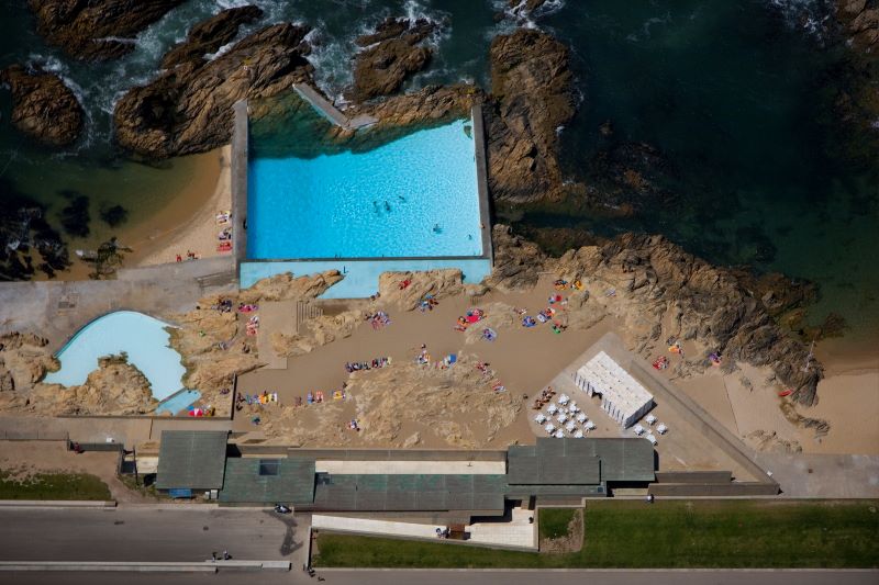 Aerial view of leça swimming pools on rocky portuguese coast