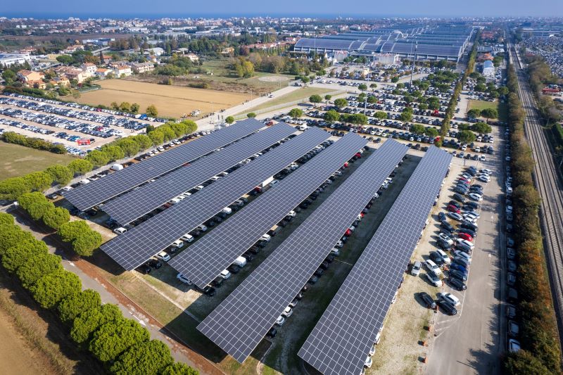 Aerial view of solar carport in coastal parking lot