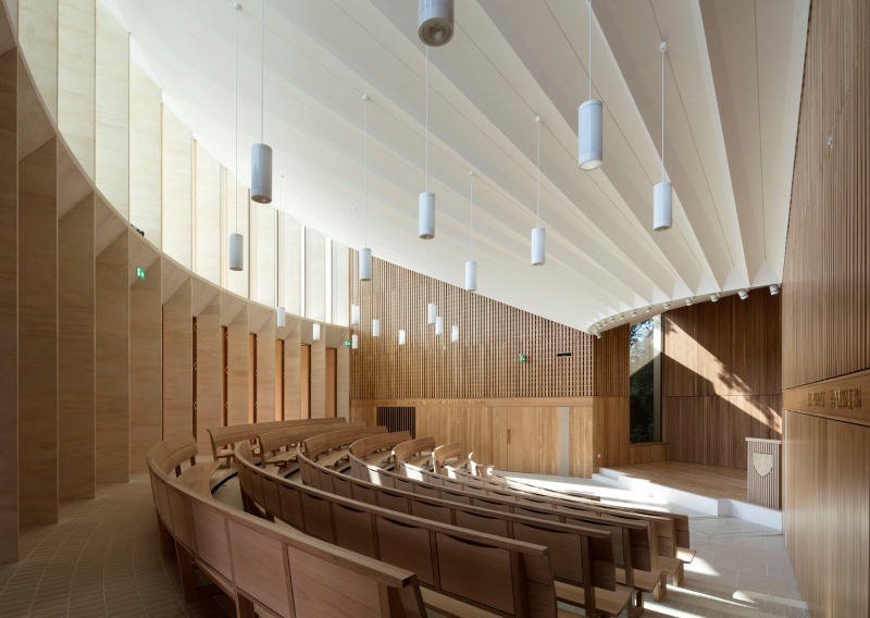 Modern minimalist chapel interior with curved seating
