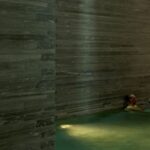 Thermal bath pool at vals spa with dark stone walls
