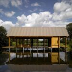 Wooden floating pavilion over calm lake